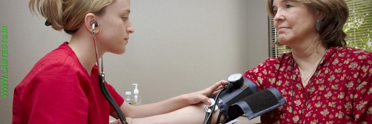woman getting blood pressure checked