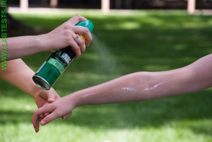 Applying insect spray containing DEET